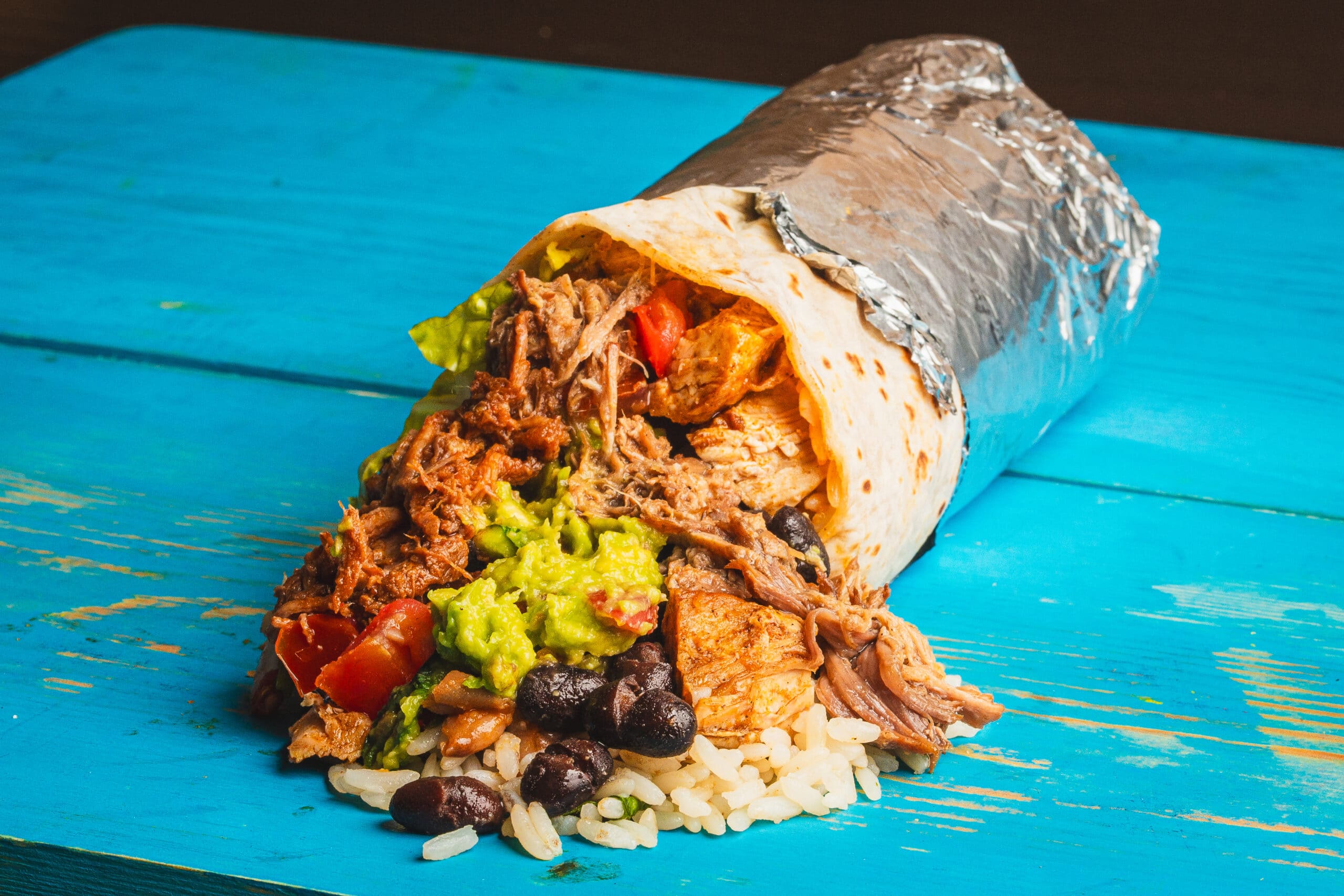 Burrito place on a blue table